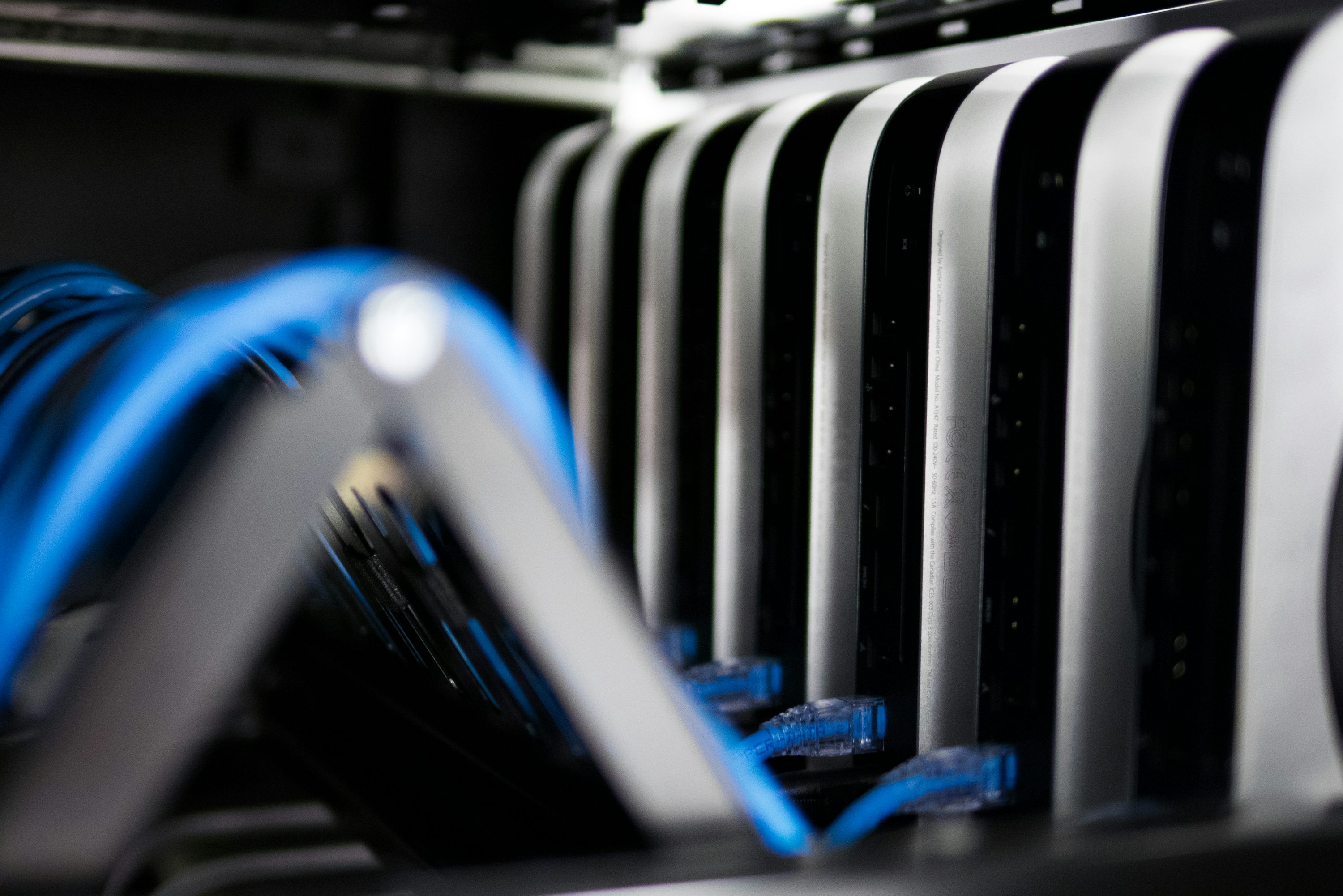 A close-up of servers and network cables in a rack.
