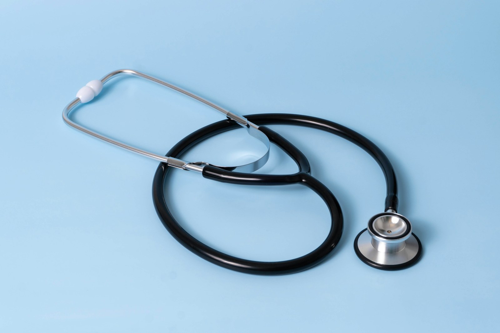 A medical stethoscope on a blue background, representing HIPAA rules for health technology