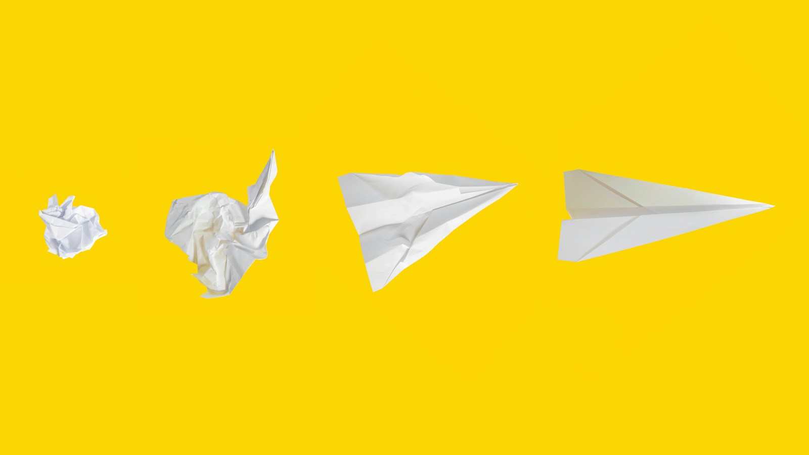 Illustrative stock photo: a white paper plane on a yellow background