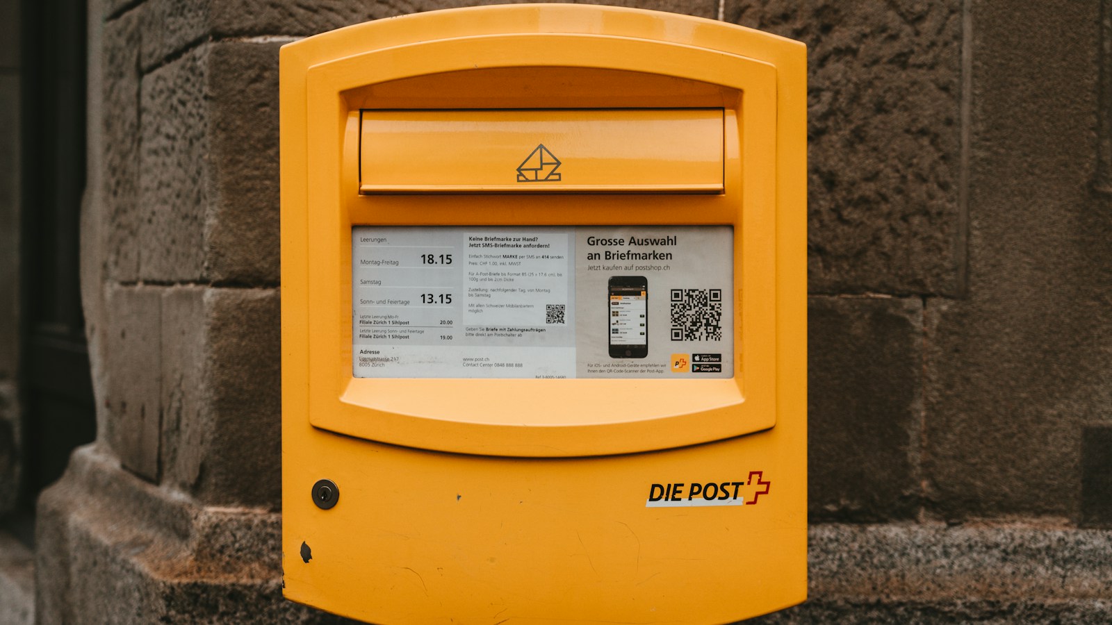 A yellow public post mailbox